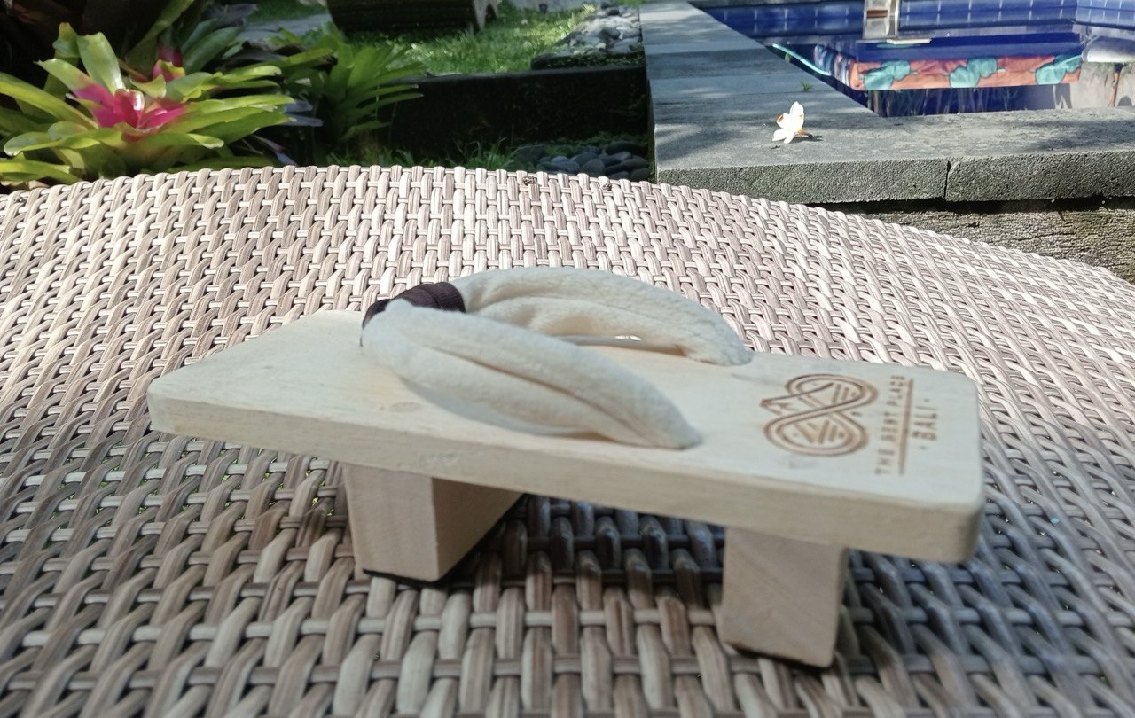Angled view of the limited edition Bali geta on woven rattan