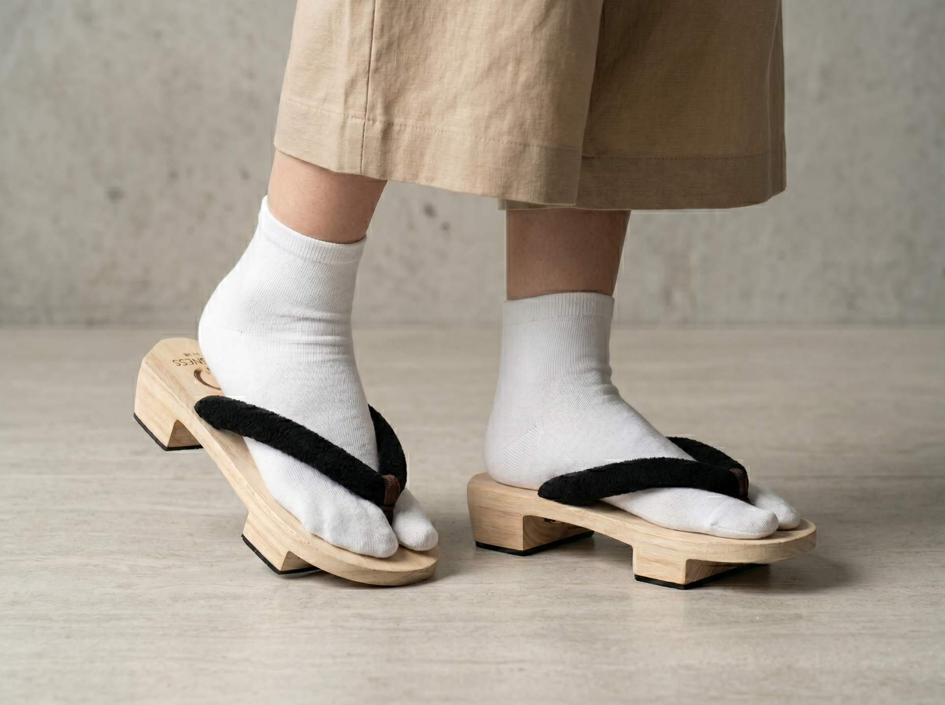 YESNESS geta worn with white tabi socks and beige linen skirt — Japandi styling
